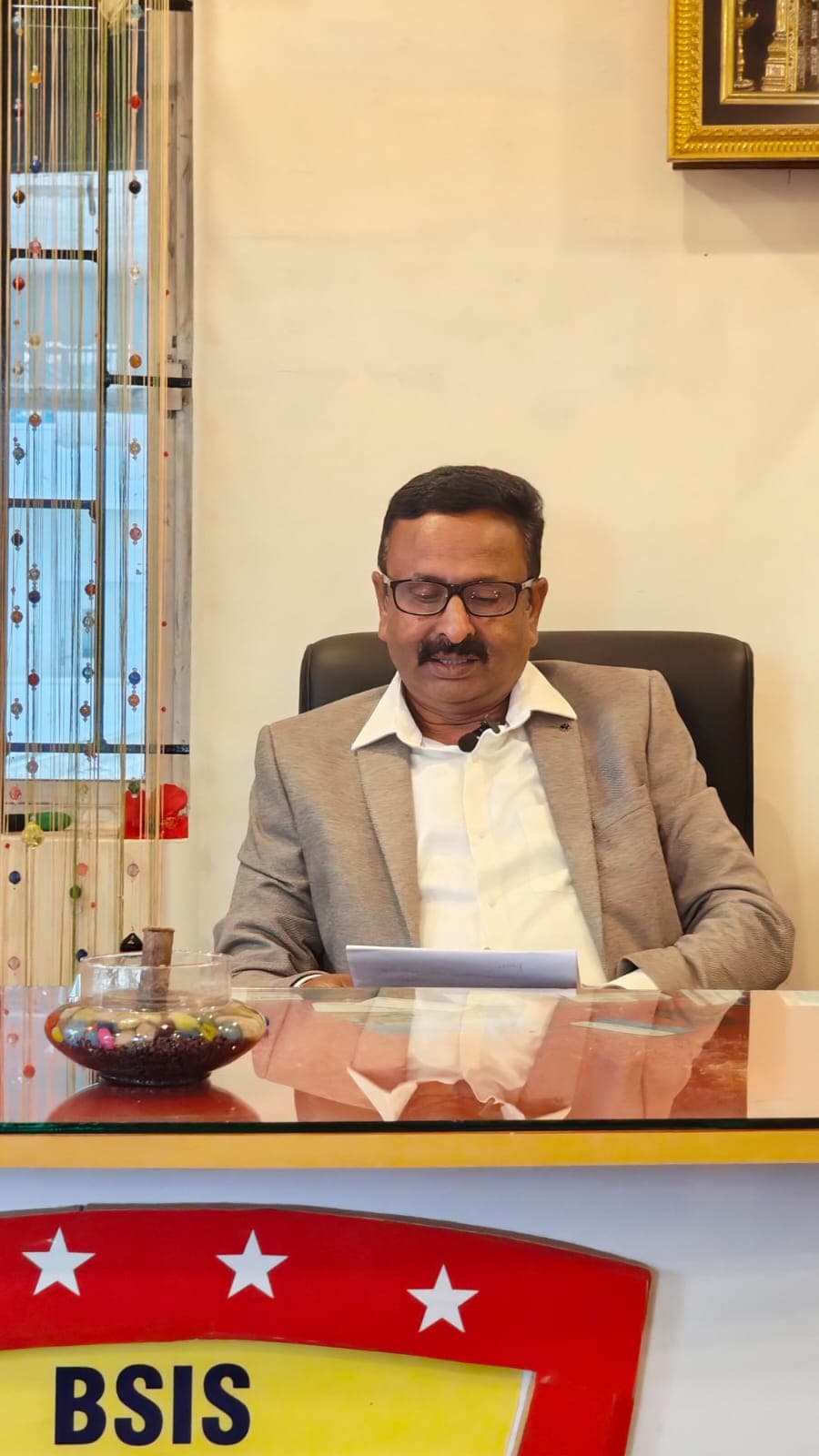 Chairman at his desk